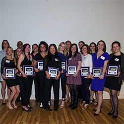 Members of the 1998 Women's Soccer team pose with plaques honoring their induction into the Athletic Hall of Fame