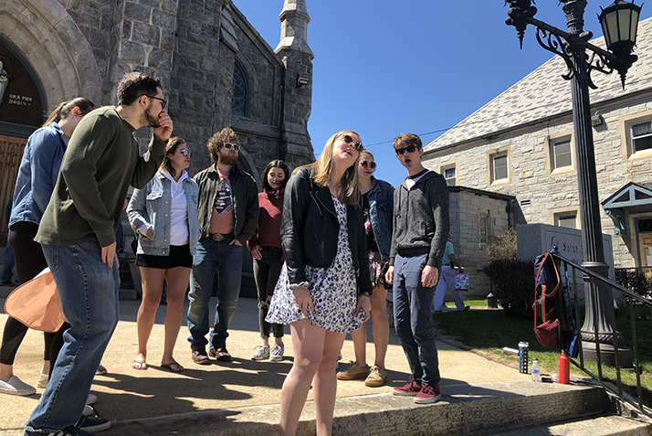 Vox Cameli, one of Connecticut College’s a cappella groups, performs in front of New London’s St. Mary's Star of the Sea Church, a stop on the walk. 