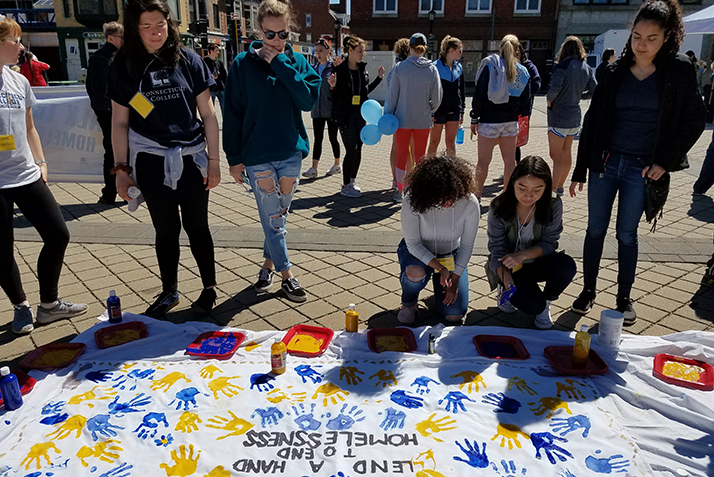 At the conclusion of the walk, participants add their handprints to a banner to show support for those facing homelessness. The banner will be displayed at the New London Homeless Hospitality Center. 