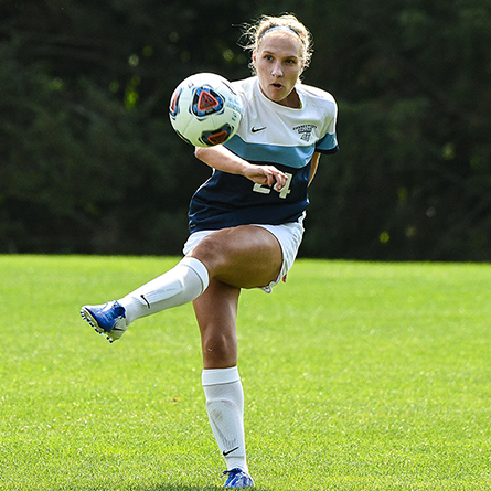 An action shot of soccer player Sara Kogelmann '20 