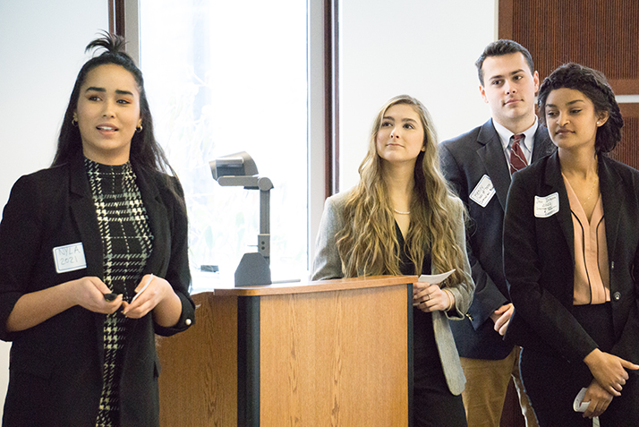 Nouhaila Oudija '21, Piper Baine '21, Henry Dresser-Kluchman '20 and Jitu Dribssa '22 present their case study recommendations to the owners of Preston Ridge Vineyard. 