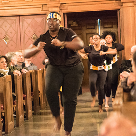 Bempa Ashia ’20 leads fellow dance students in the opening performance at the “Dreaming of Another World” event in Connecticut College’s Harkness Chapel Jan. 27. 