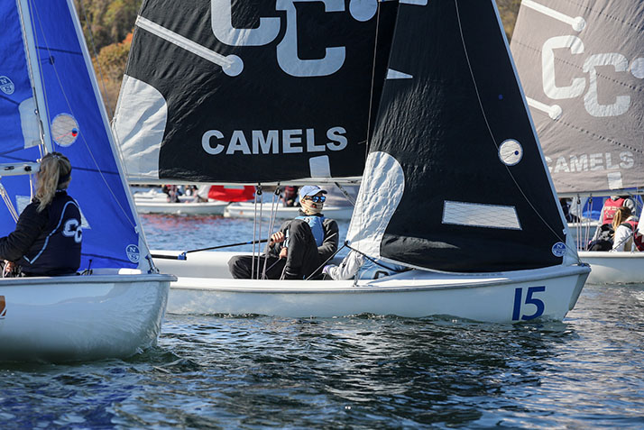 A Conn sailor competes against Boston College in a head-to-head regatta