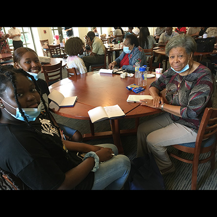 Donetta Hodge (R) shares her story with local students Cheadlen Petit-Frere and Tyazia Lawson. Photos courtesy of Emilia Otte and the Connecticut Examiner. 
