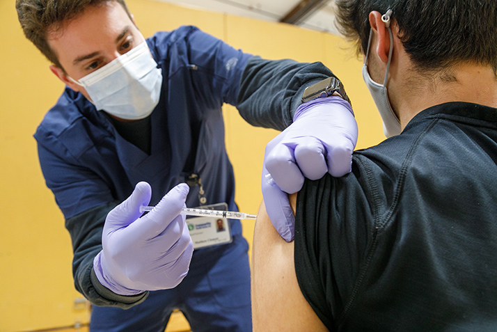 A nurse administers the COVID-19 vaccine. 