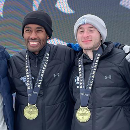 Matt Carter ’23 and Jeffrey Love ’23 with their medals at the NCAA Championships.
