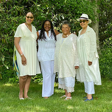 Professor Kate Rushin (far right) poses with poets Antoinette Brim-Bell, Rhonda Ward and Marilyn Nelson at the Juneteenth celebration. 