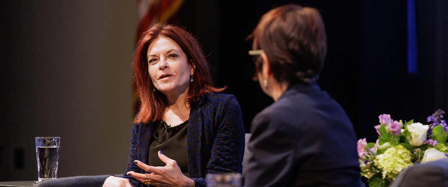 Rosanne Cash talks with President Katherine Bergeron on stage at the Athey Center for Performance and Research at Palmer Auditorium