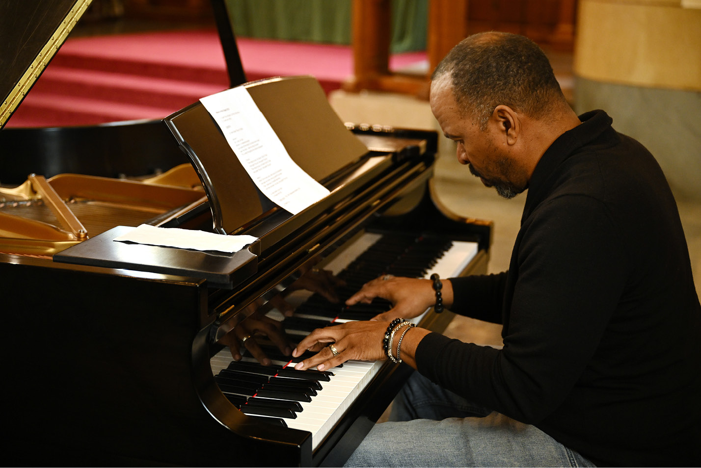 Sean Lilly provides accompaniment on piano at a Music in the Chapel event at Harkness Chapel in February.
