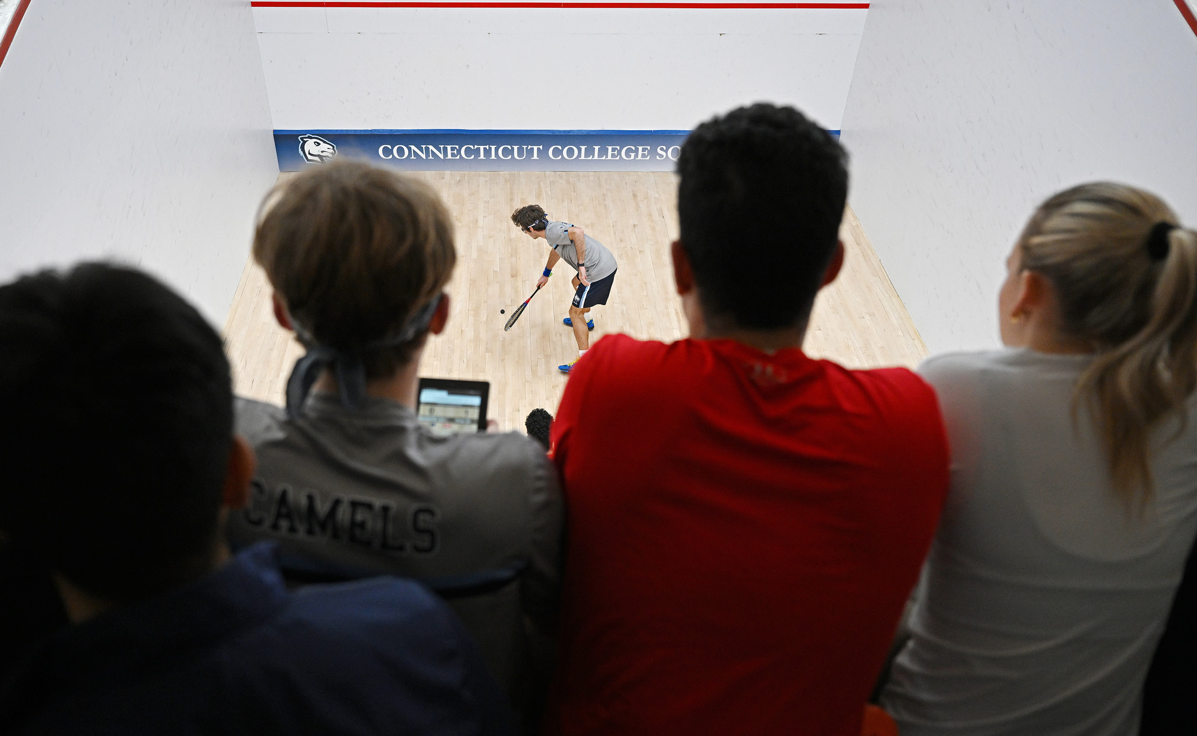Photo of player on squash courts from above