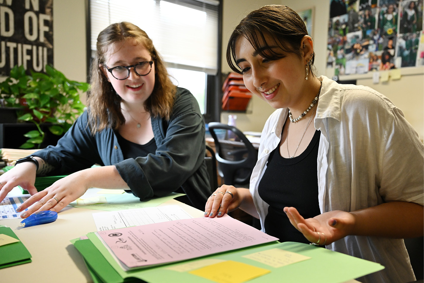 Civic Leaders Sarah Goodman Duffy ‘26 and Leila Merhi ‘25 review Teen Development and Employment Program applications at New London Youth Affairs, as they prepare to assemble orientation packets for summer employment youth in late June at the New London Youth Affairs office.