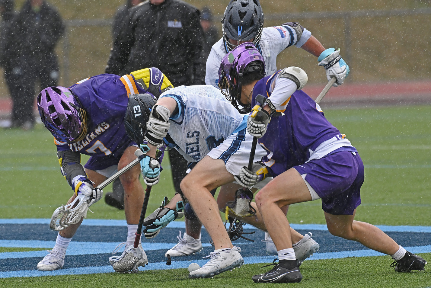 Midfielder Aidan Gaudet ’25 loses his mouthpiece during a face-off vs. Williams.