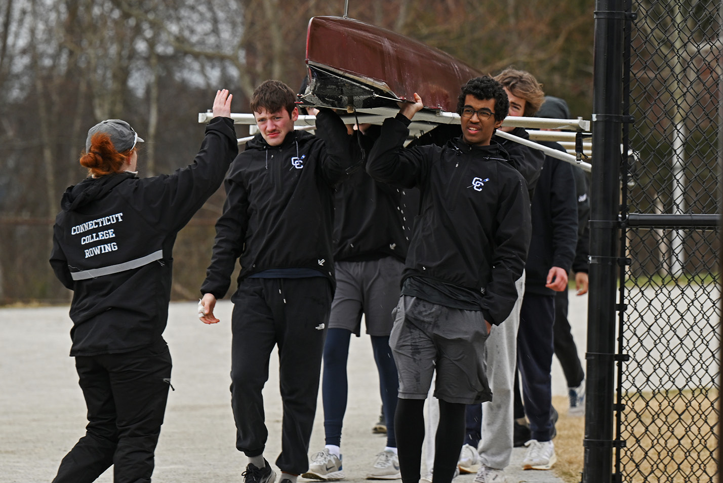 The Connecticut College men’s rowing team returns from a practice on the Thames River