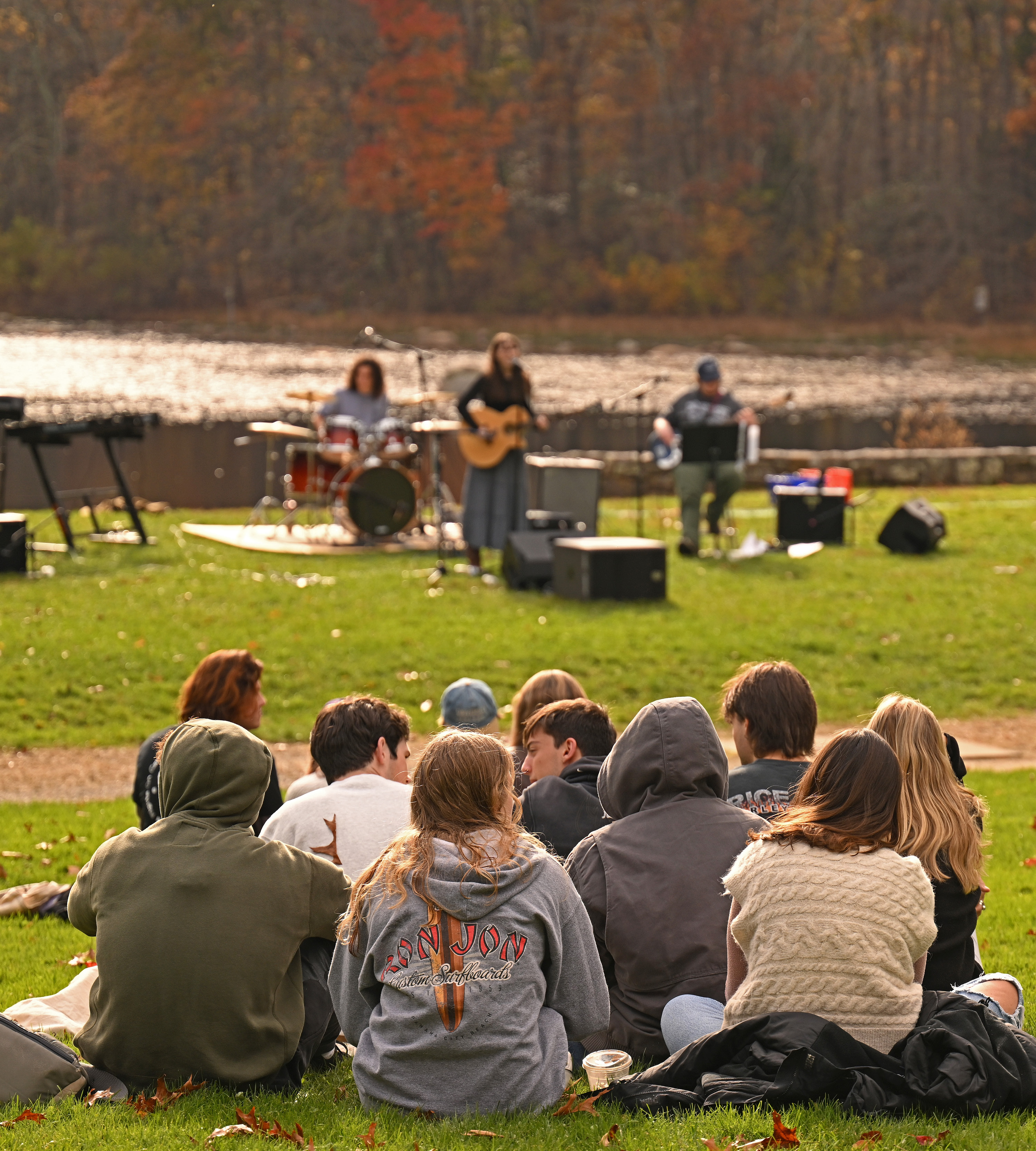 Students listen to music in the Arboretum