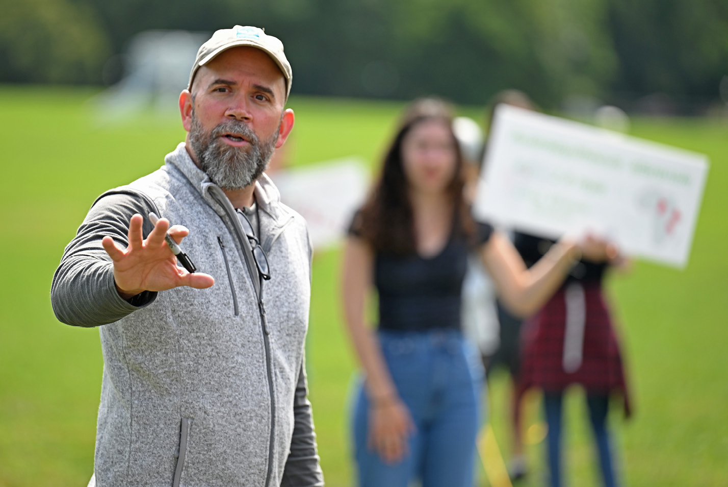 Prof. Graesch leads Anthropology class in creating a giant timeline of human species on Tempel Green