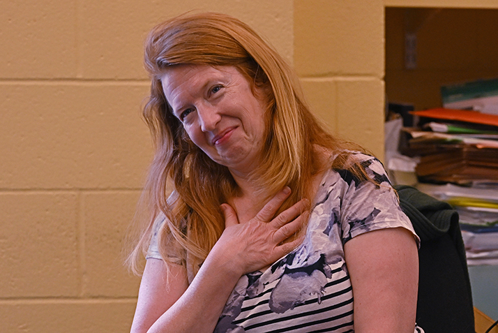 Jennifer Lamb reacts to learning she's been selected for a staff award.
