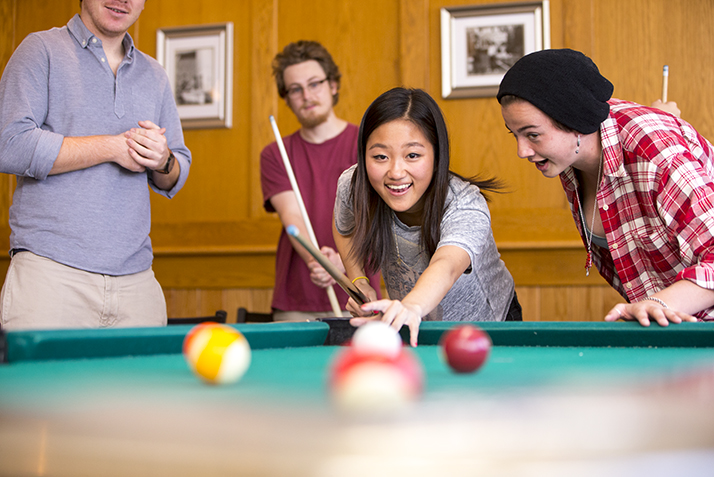 Students play pool.