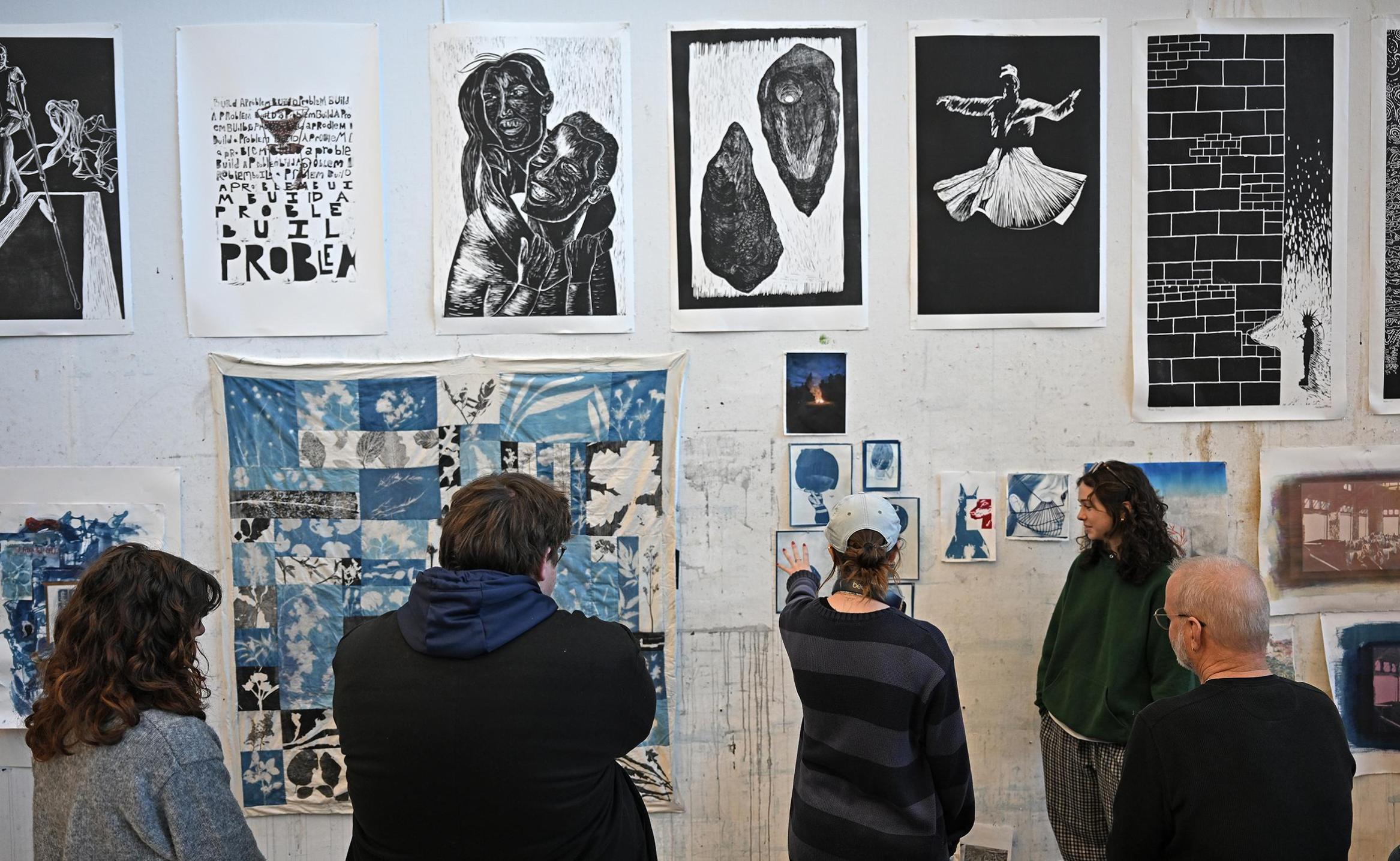 Students participate in a Printmaking class critique.