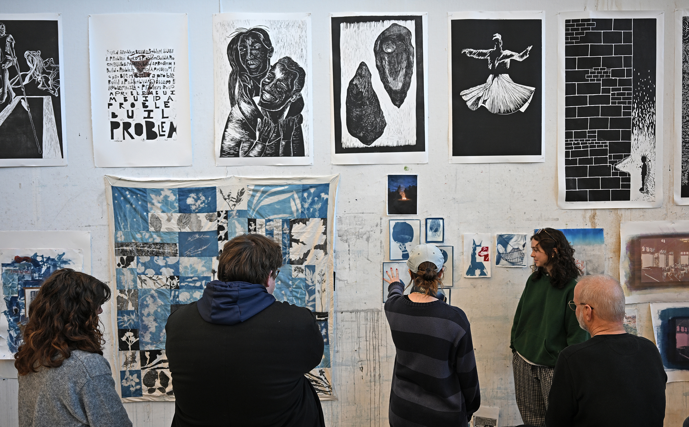 Students participate in a Printmaking class critique.