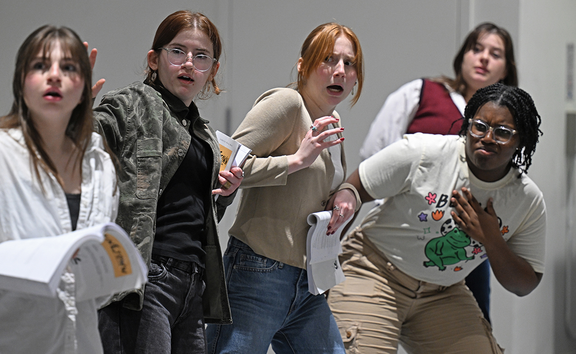 five actors all make dramatic facial expressions