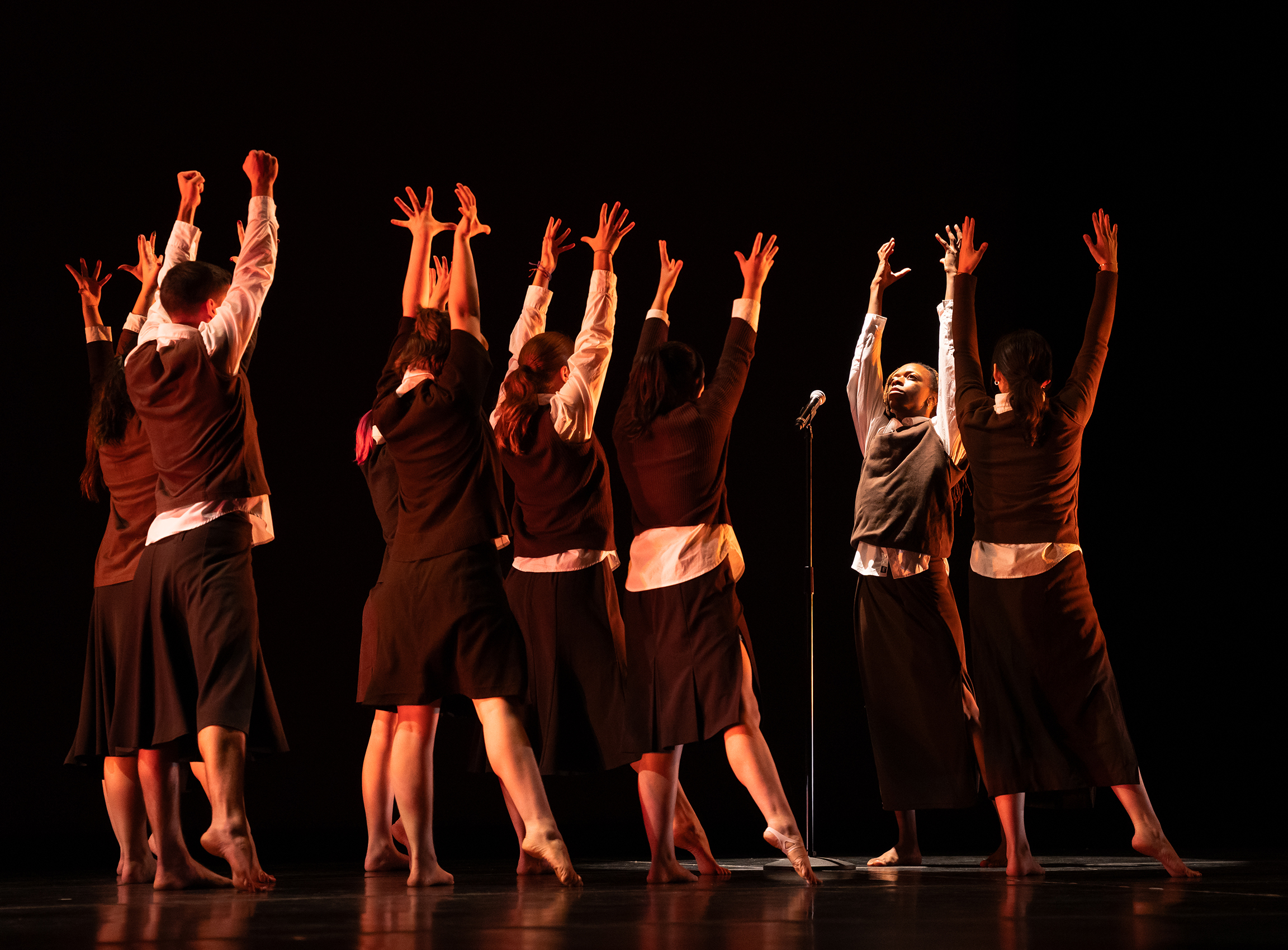 Student dancers perform on stage.