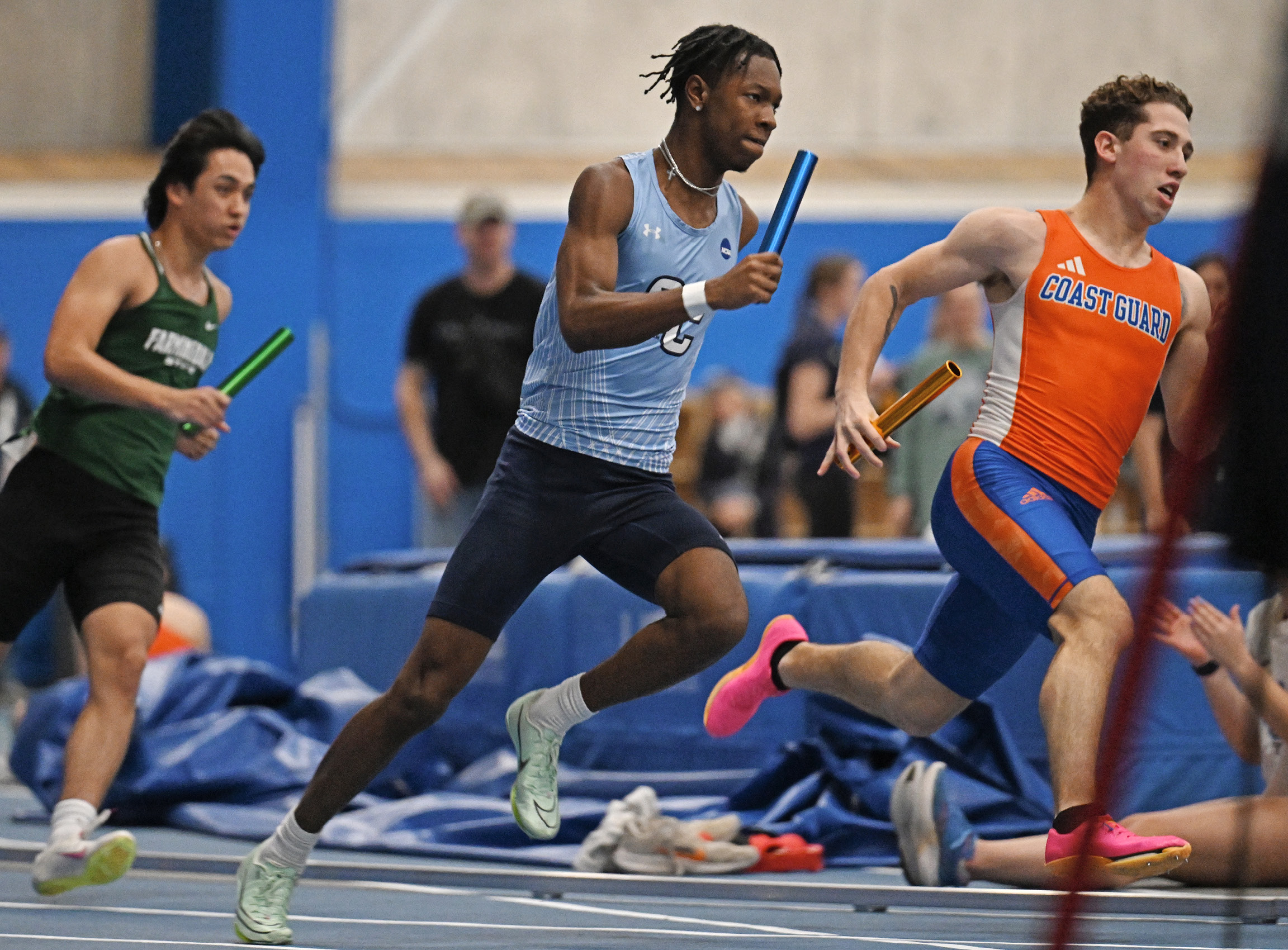 Jayson Firmin ’25 runs a leg of the 4x200 meter relay at the Coast Guard Invitational in January.