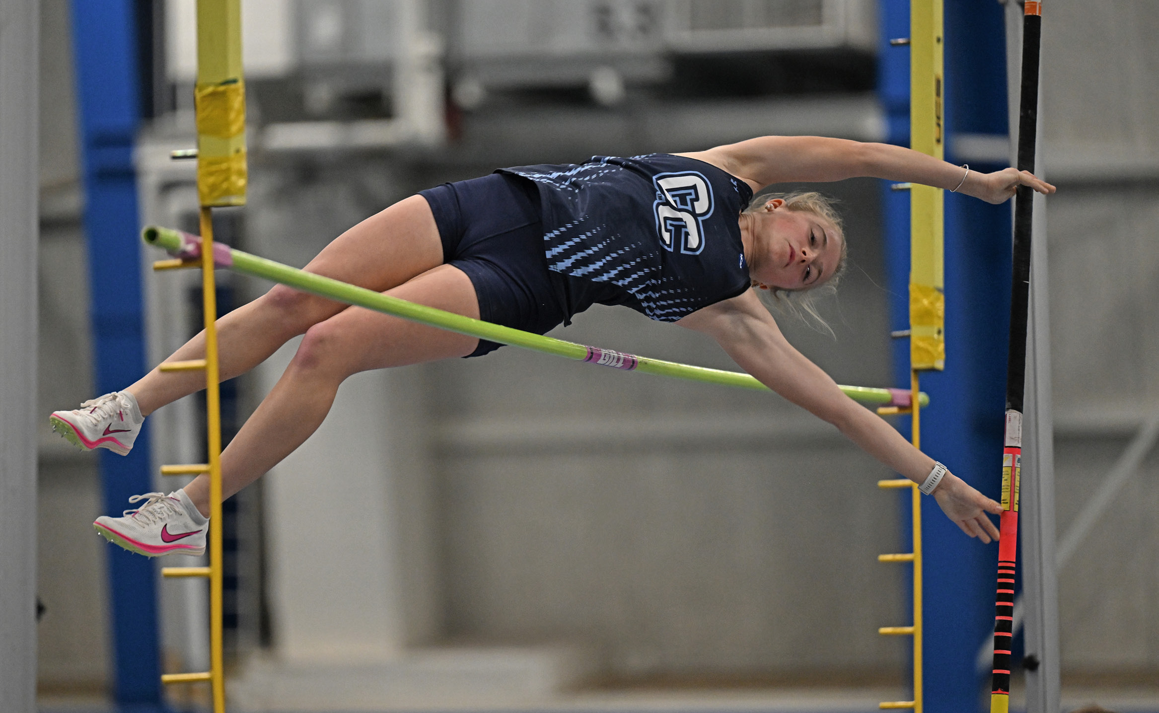 Chase Ireland ’27 clears the bar at 8-2.5 in the pole vault at the Coast Guard Invitational in January.
