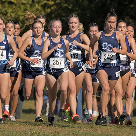 Members of the Women's Cross Country team compete in a race.