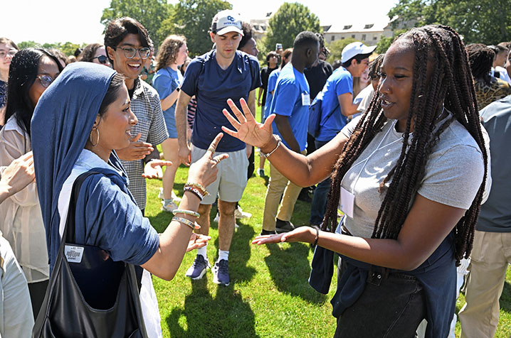 Students participate in ice breaker activities.