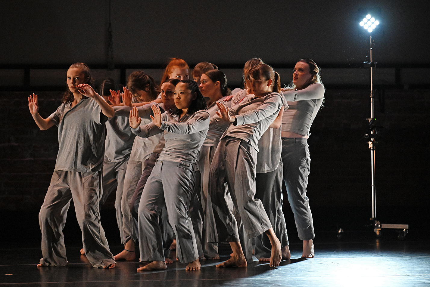 College dance students perform on stage.