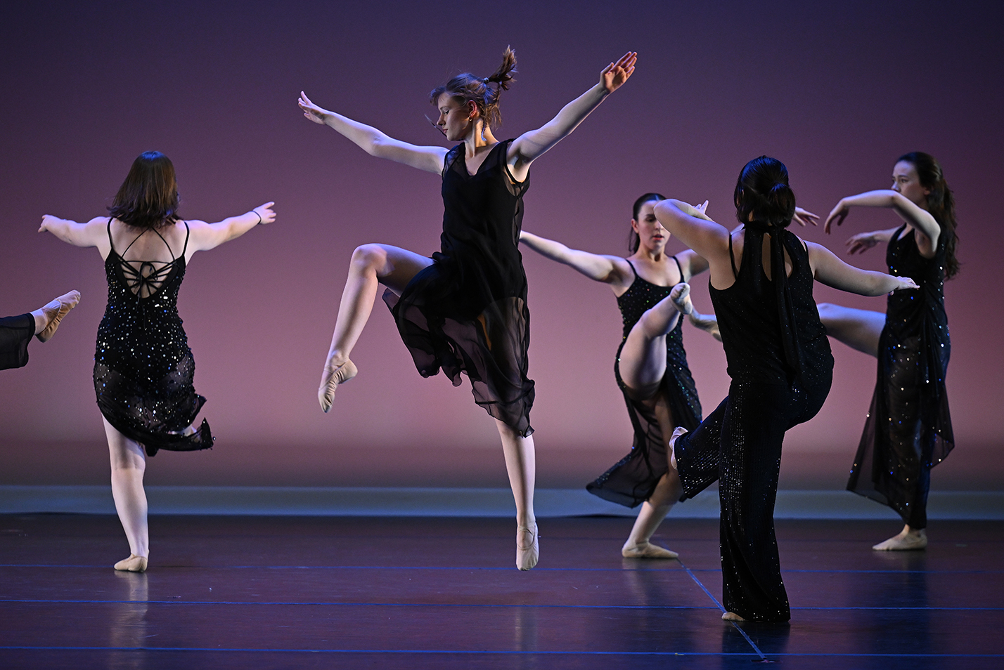 College dance students perform on stage.