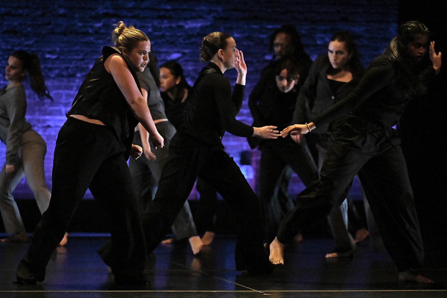 College dance students perform on stage.