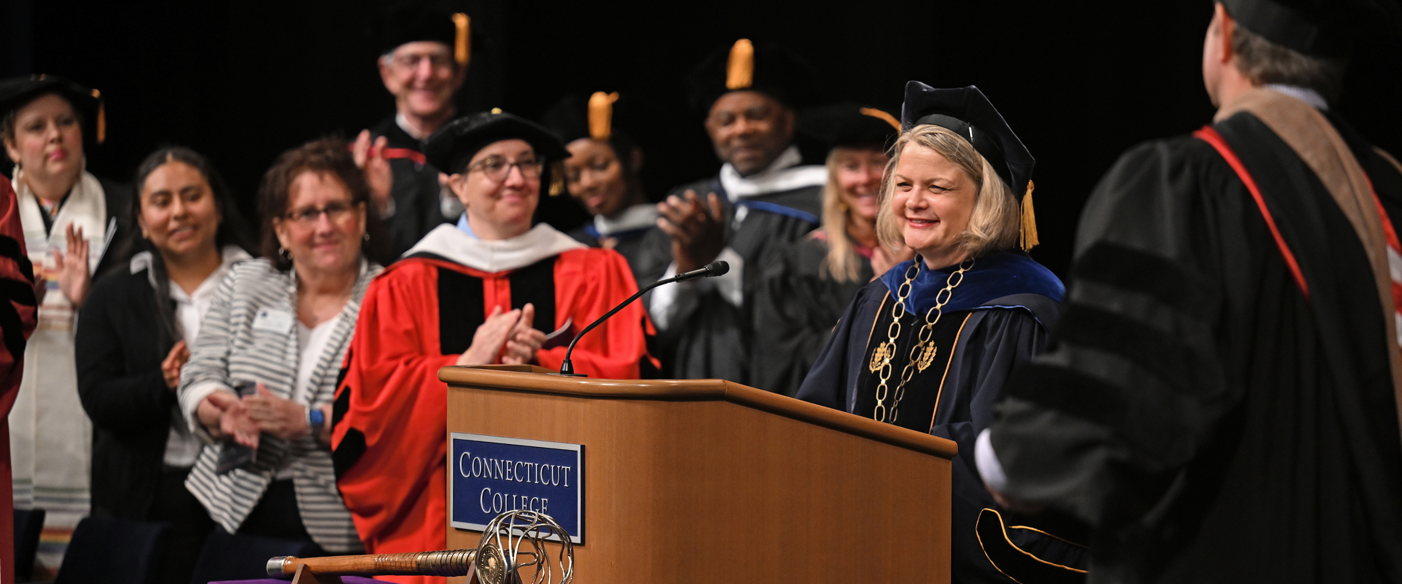 The platform party applauds President Chapdelaine upon her inauguration as 12th President of Connecticut College