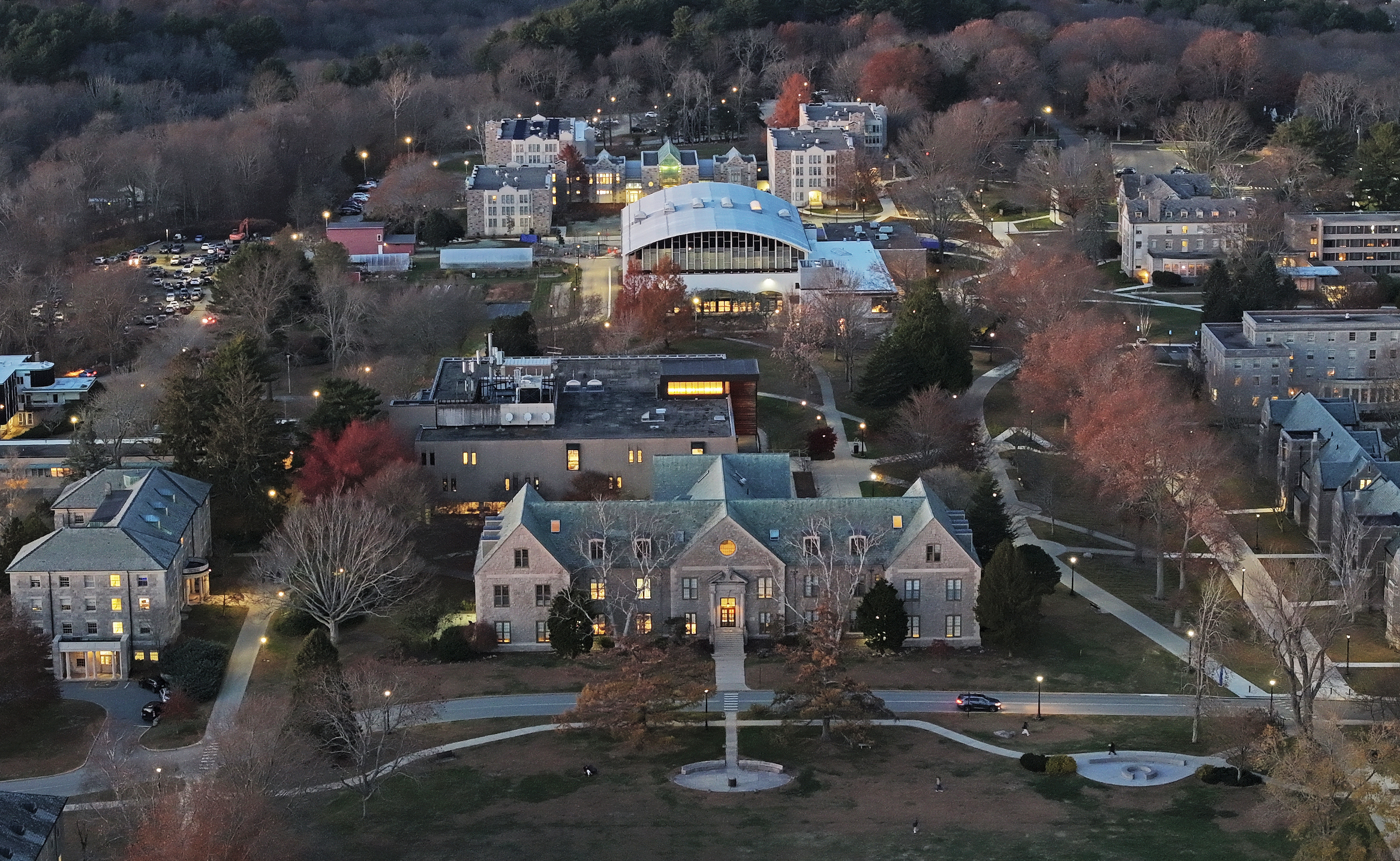 An aerial view of a college campus at dusk.