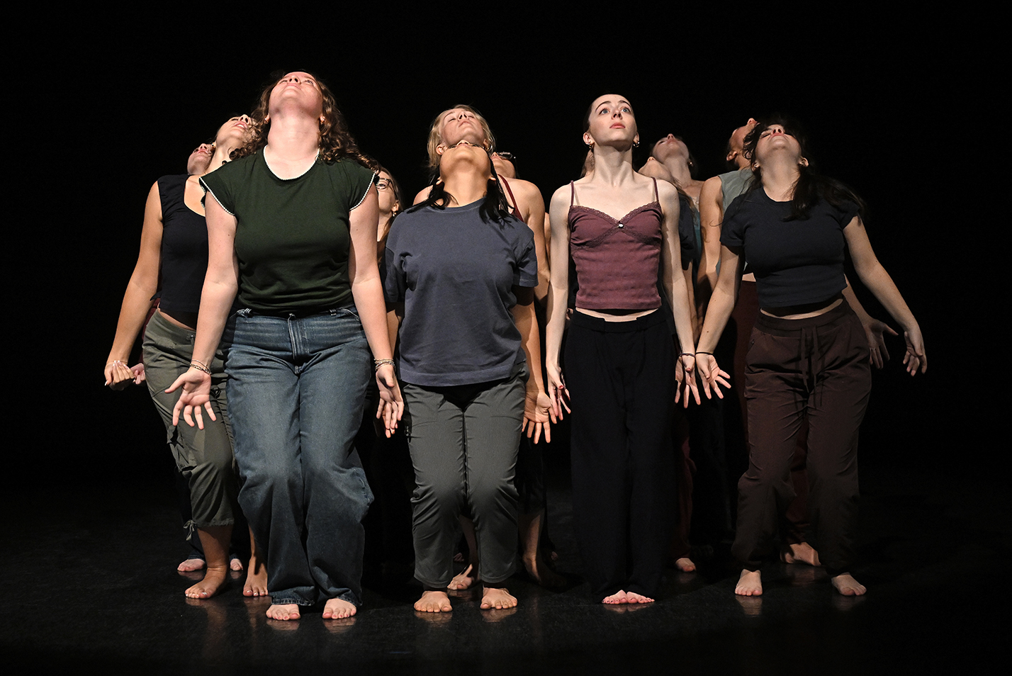 Student dancers perform modern dance in a dance studio.