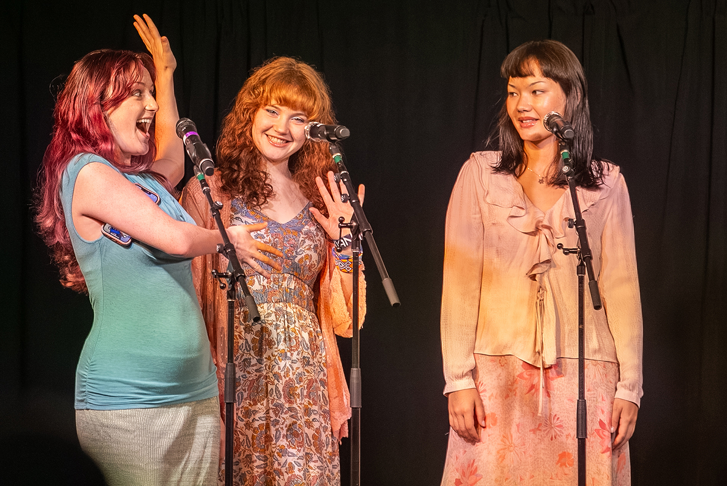 a college a cappella group performs on stage.