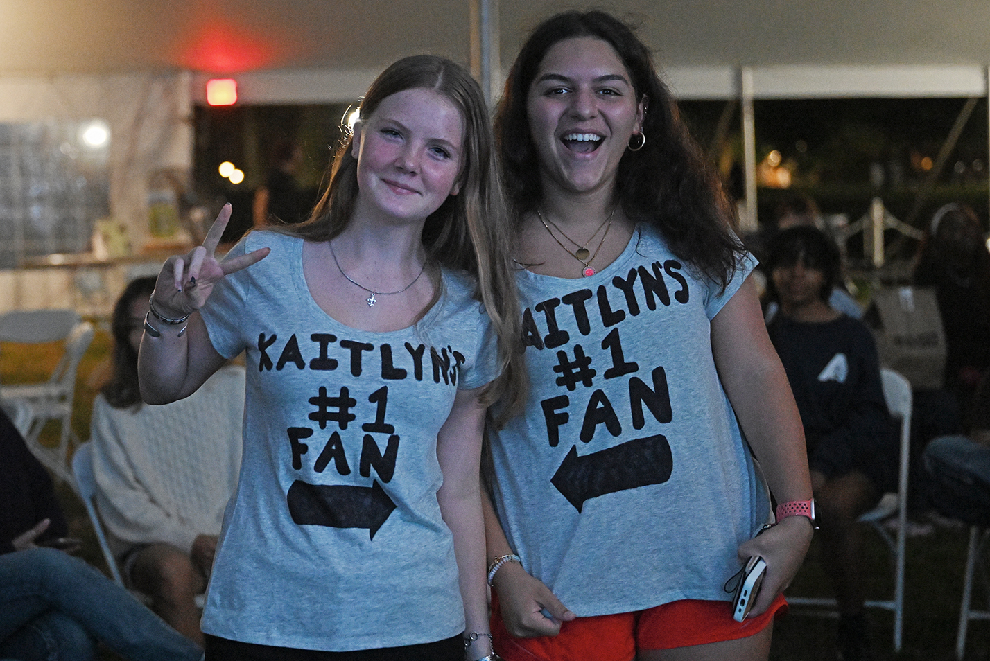 Two female students sport t-shirts with 