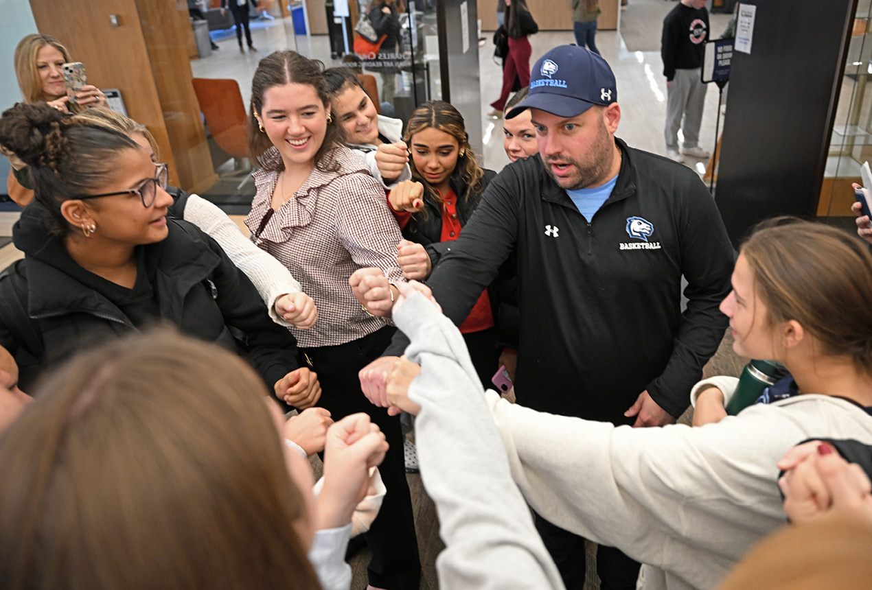 Students cheer at the All College Symposium
