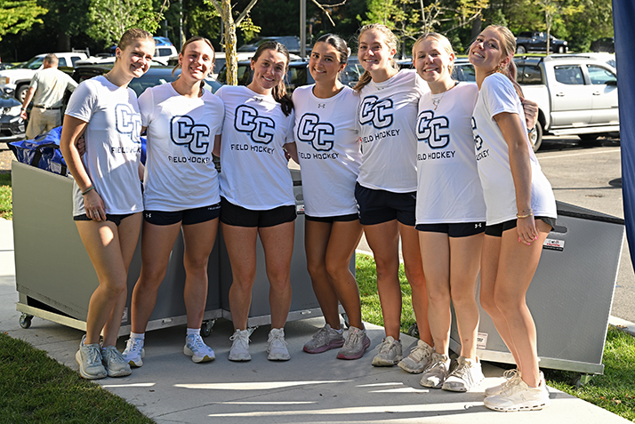 Members of the field hockey team pose for a group photo.