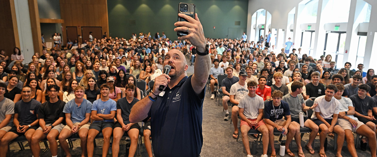 Associate Dean of Campus Life Geoff Norbert takes a Class of 2030 selfie