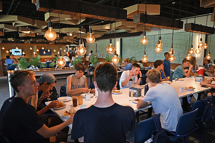Students enjoy a meal in the dining hall.