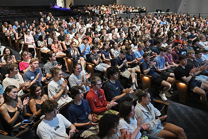 Students clap in Palmer Auditorium