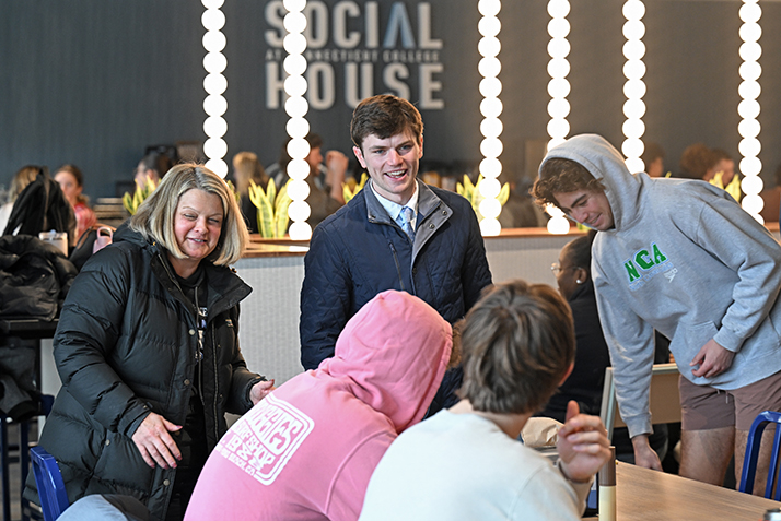 President Chapdelaine and RJ Casey '26 in the dining hall for lunch.