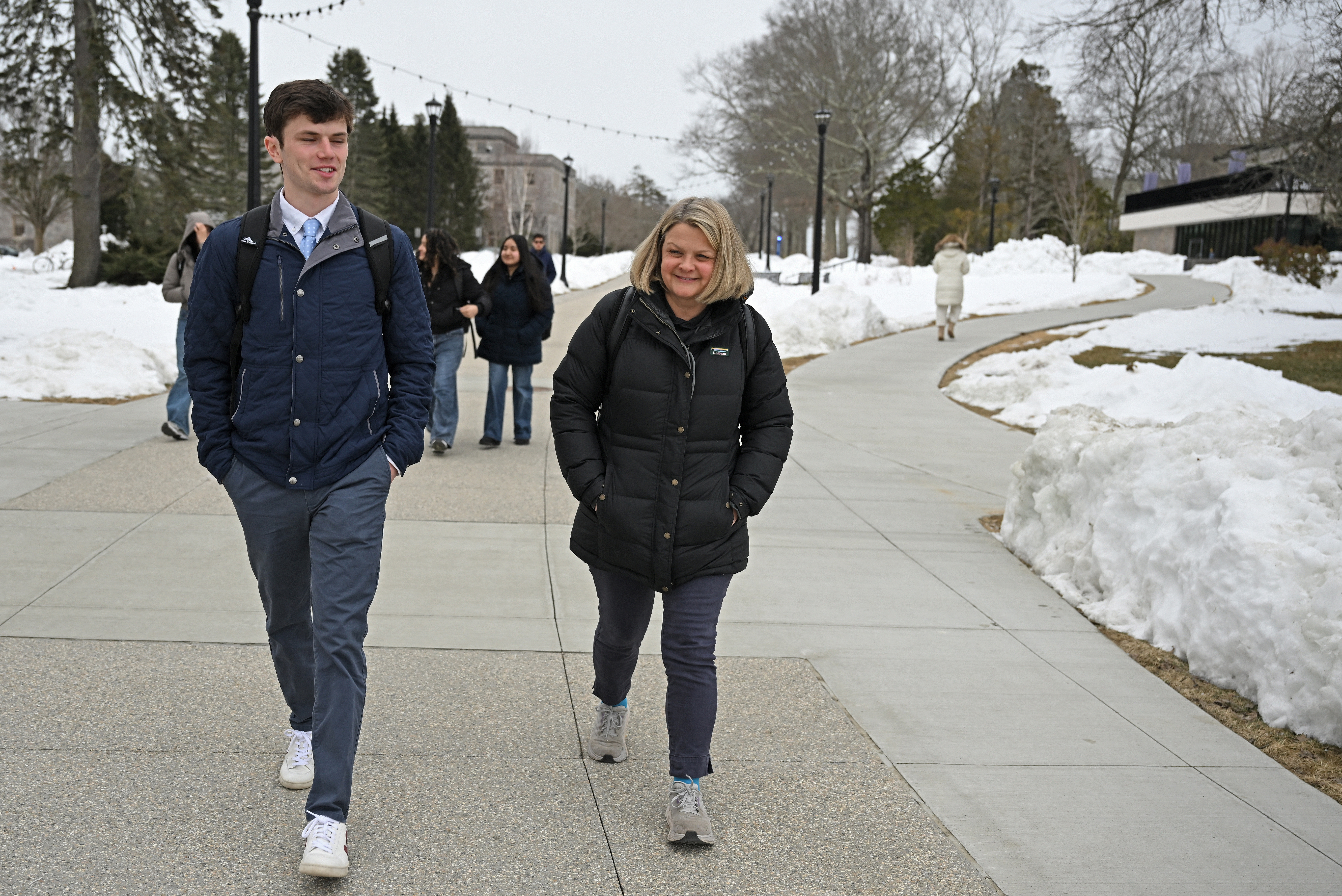 RJ Casey '26 and President Chapdelaine walk together across campus.