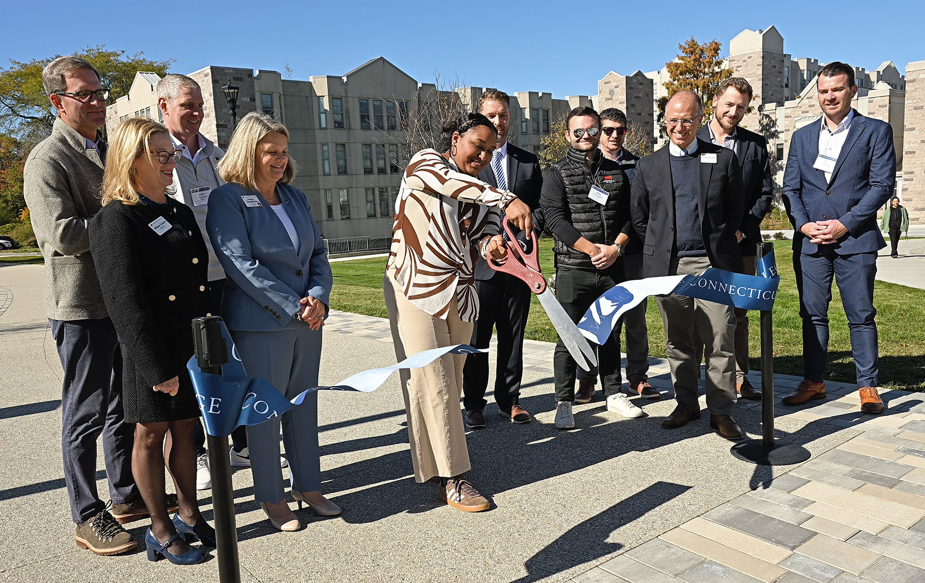 Afaf Albur ’27 cuts the ribbon during the opening event for the Cro-Plex Connector.