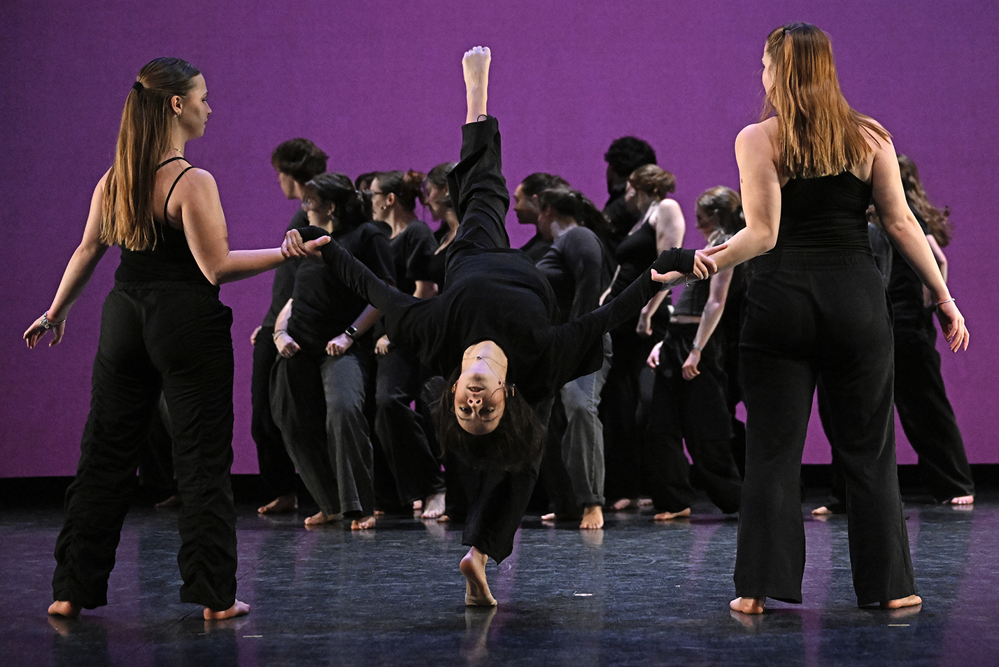 Student dancers perform in a dance studio.