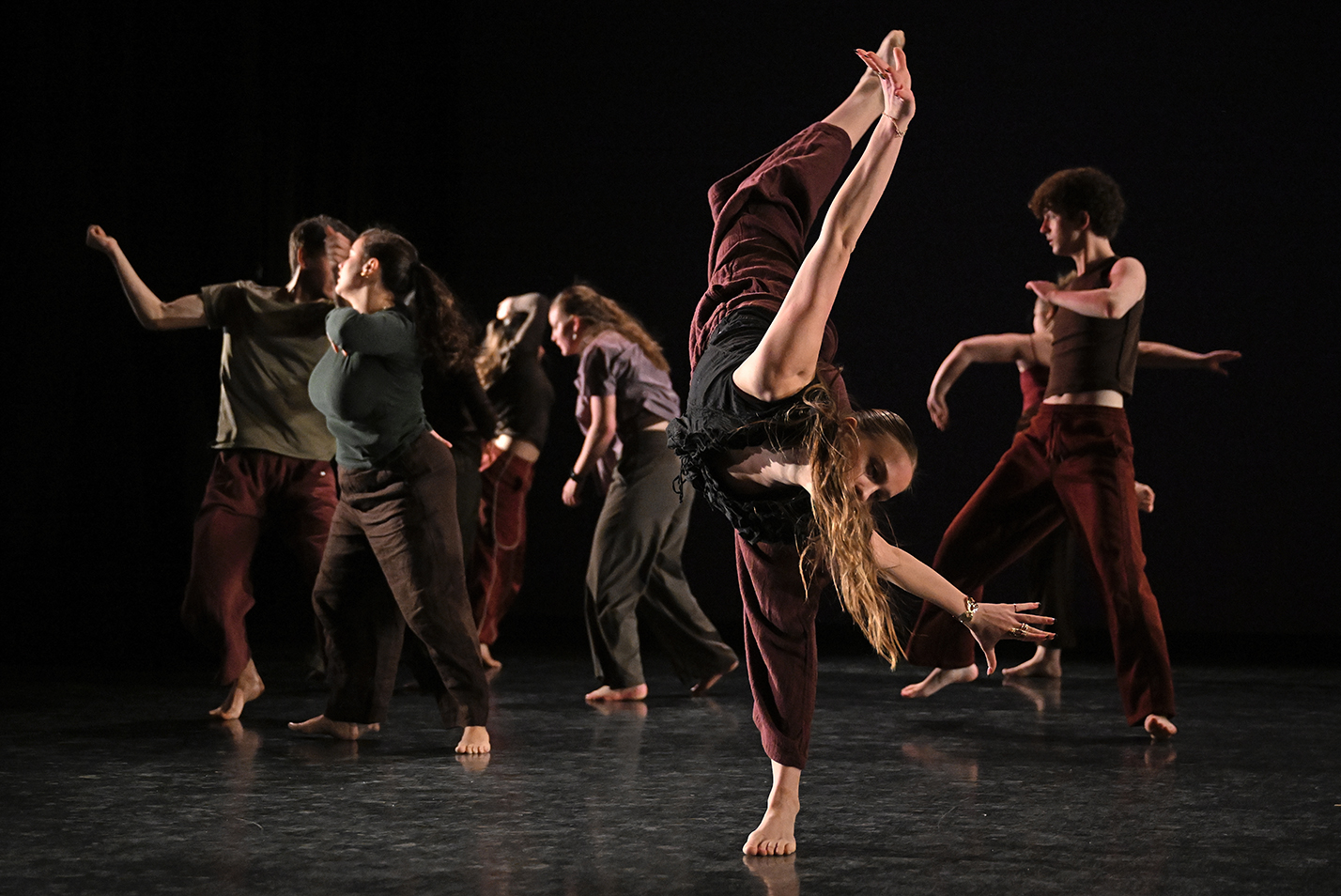 Student dancers perform in a college dance studio.