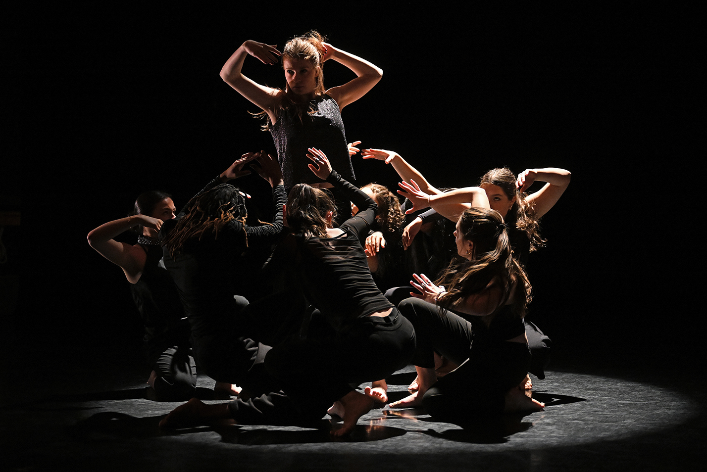 Student dancers perform in a college dance studio.