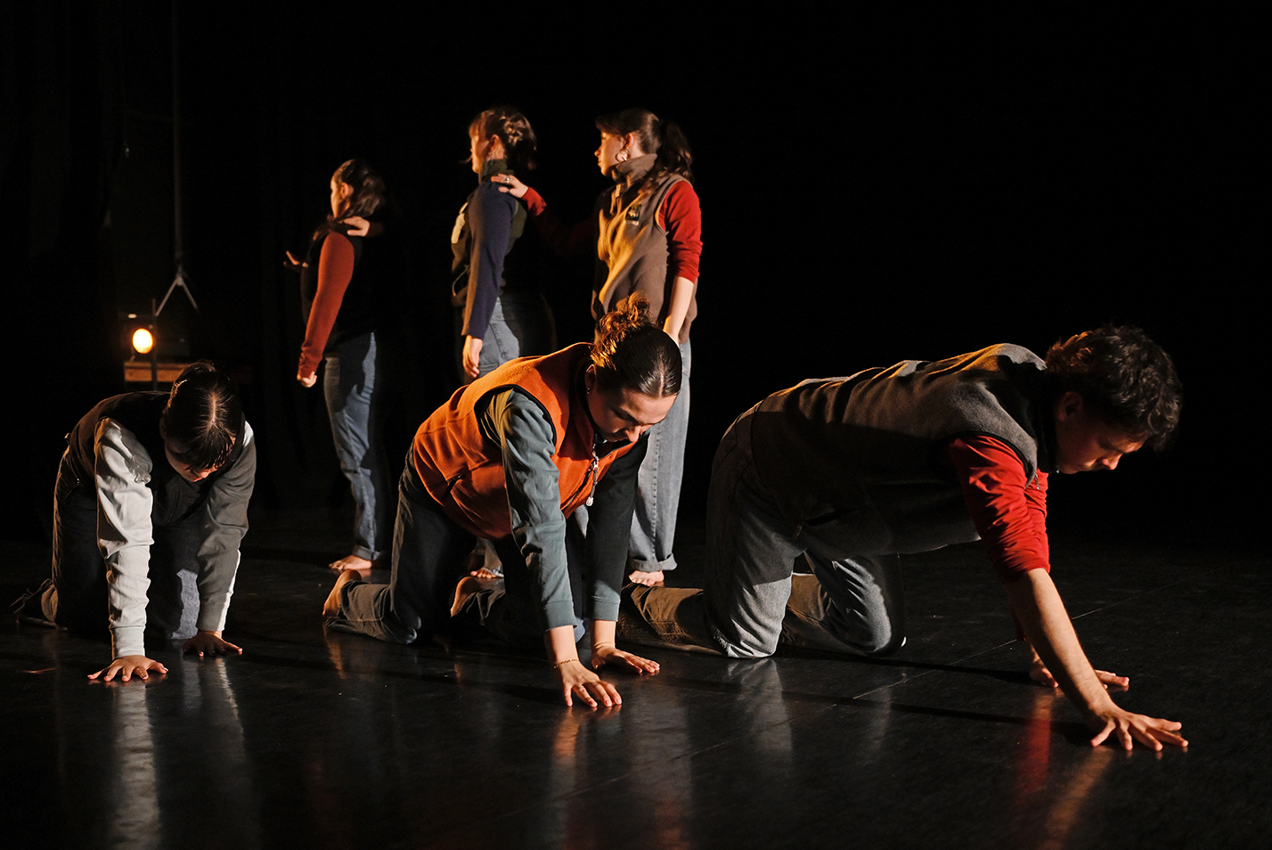 Student dancers perform modern dance in a dance studio.