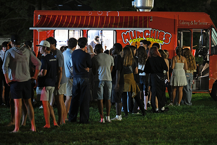 Students visit a food truck during the Welcome Weekend Block Party.